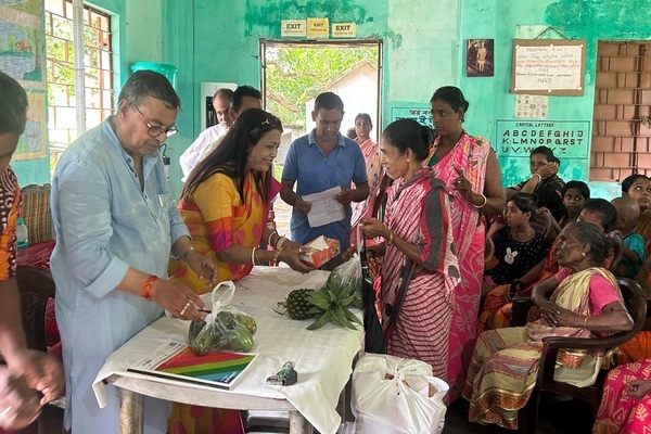 Tripura Agri Minister shares fruits from his orchard with villagers